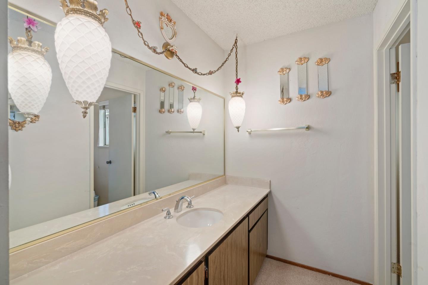 2885 Berryessa Road San Jose, CA 95132 - Photo 17 of 21 a bathroom with a sink and mirror