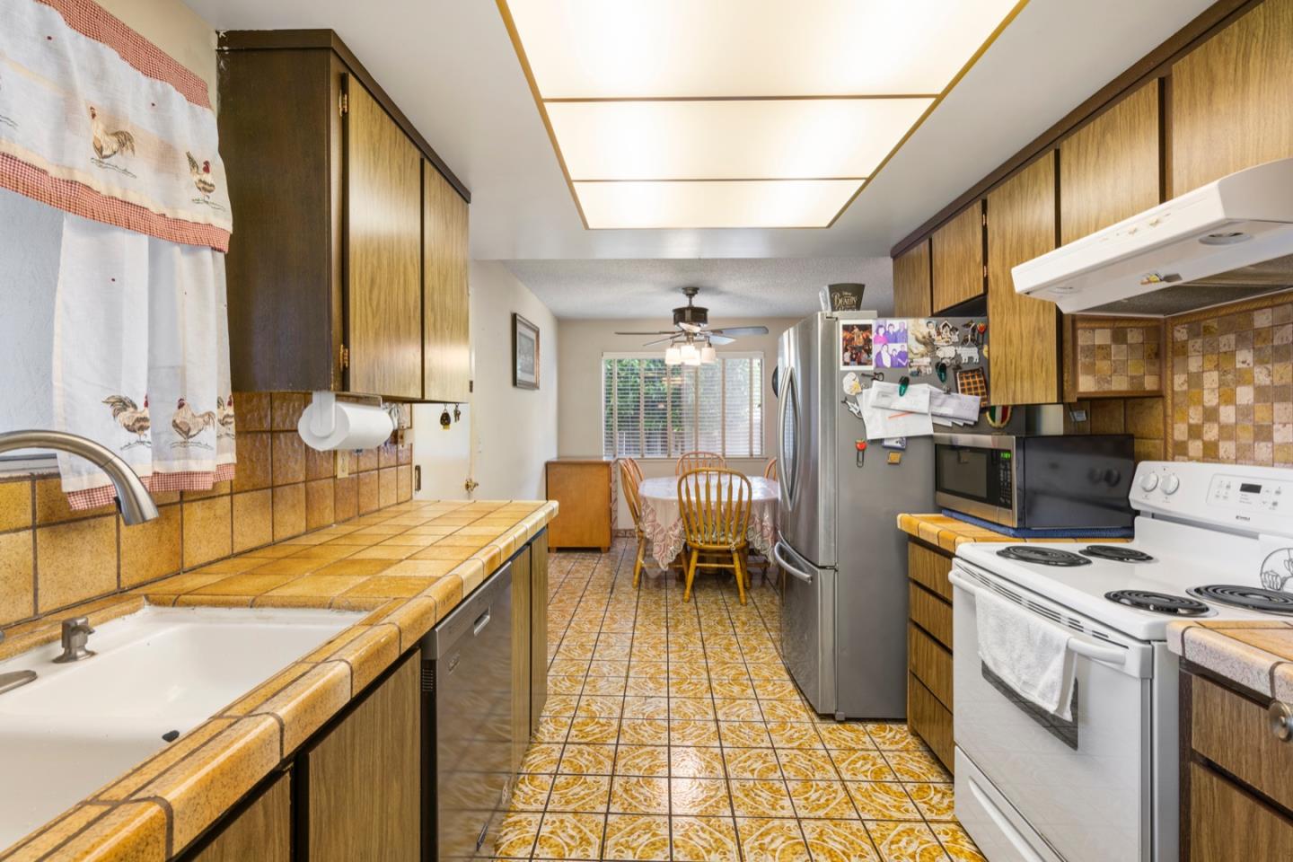 2885 Berryessa Road San Jose, CA 95132 - Photo 4 of 21 a view of a kitchen with appliances and cabinets