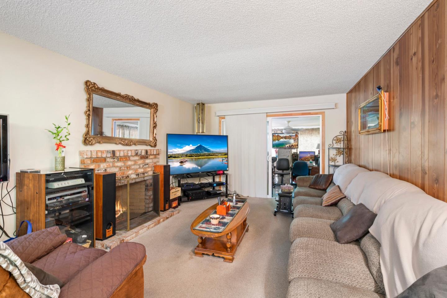 2885 Berryessa Road San Jose, CA 95132 - Photo 8 of 21 a living room with furniture and a flat screen tv