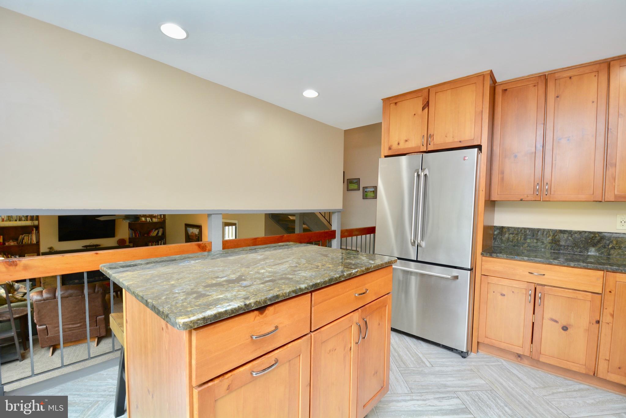 5947 Hall Street Springfield, VA 22152 - Photo 9 of 38 Porcelain Tile flooring and granite counters.