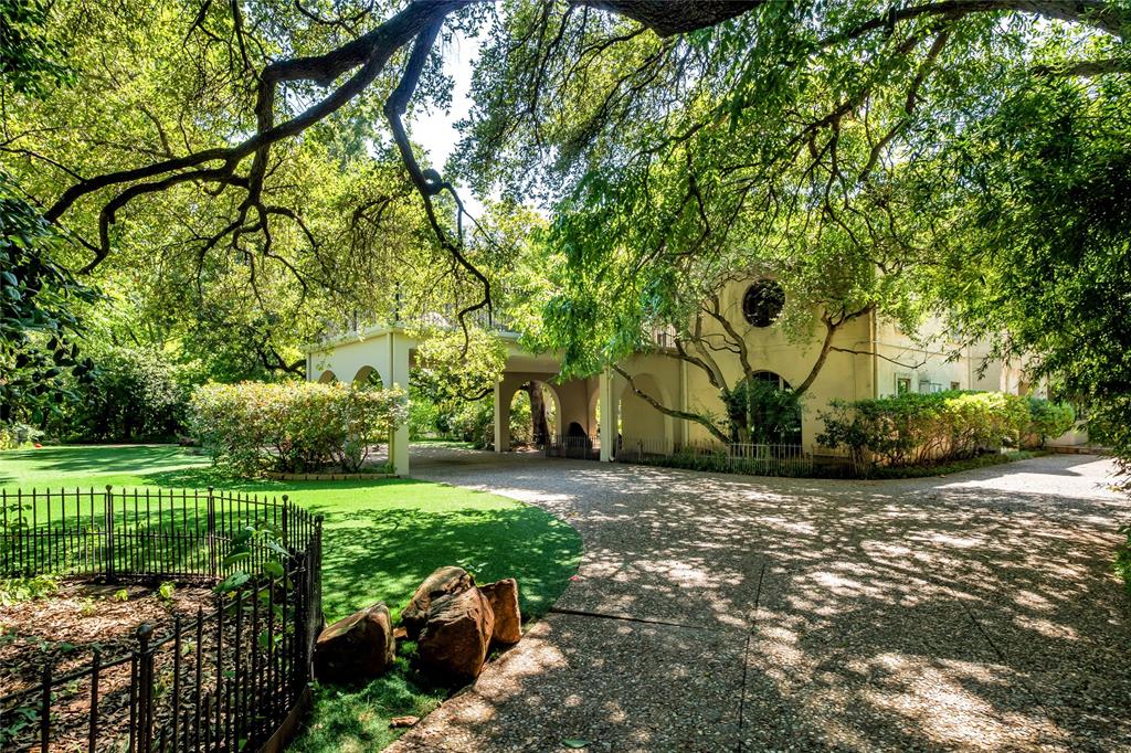 9909 Preston Road Dallas, TX 75230 - Photo 12 of 22 a view of a park with plants and large trees