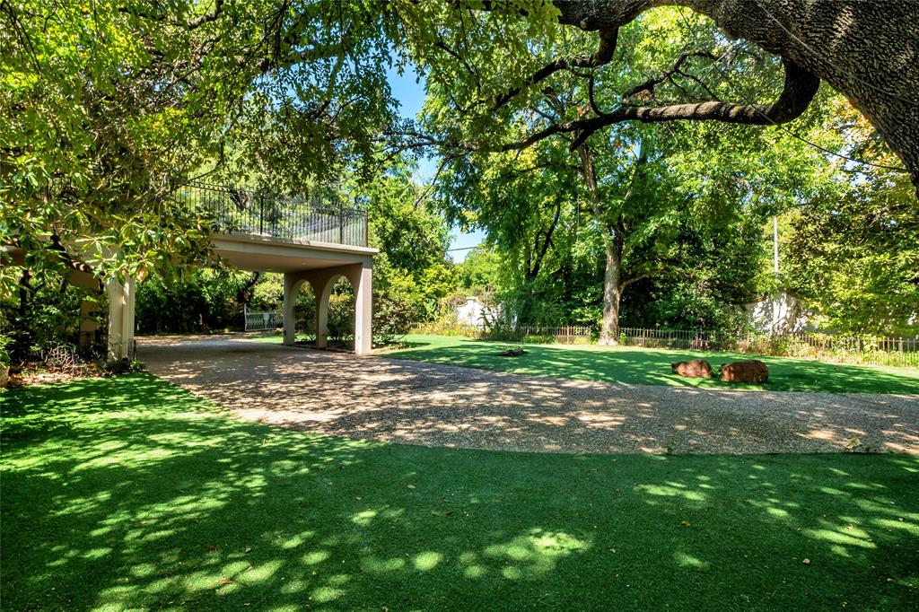 9909 Preston Road Dallas, TX 75230 - Photo 14 of 22 a view of a backyard with a garden