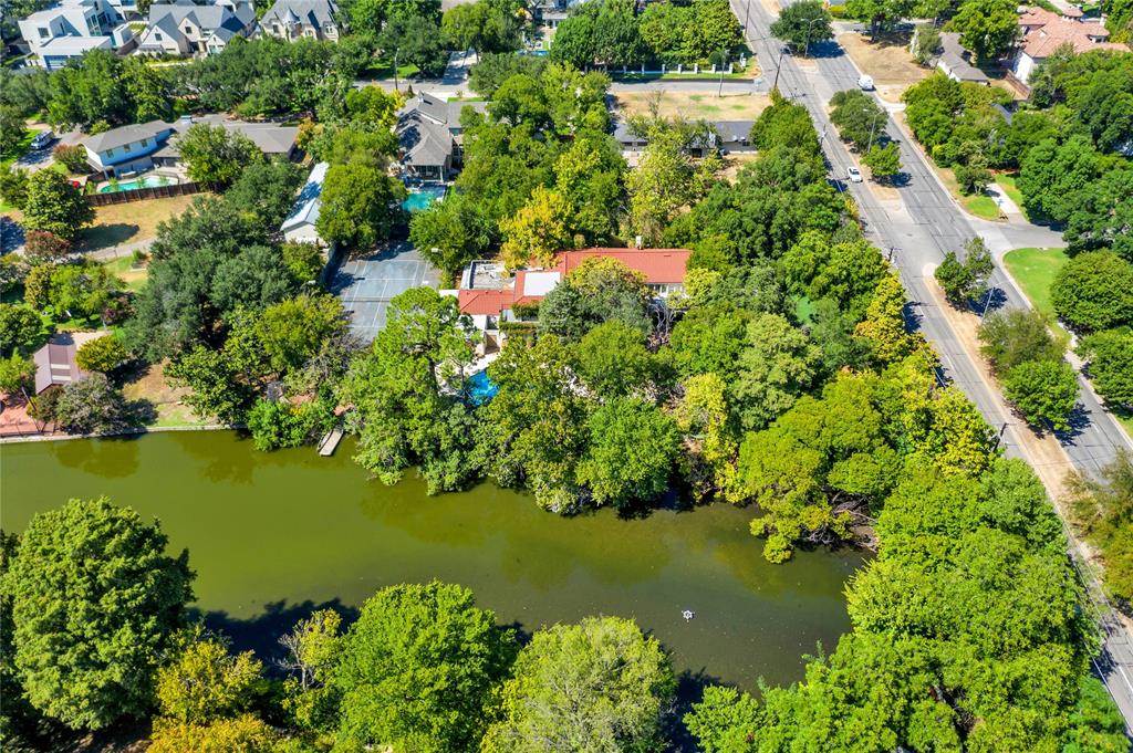 9909 Preston Road Dallas, TX 75230 - Photo 9 of 22 an aerial view of residential houses with outdoor space and trees all around