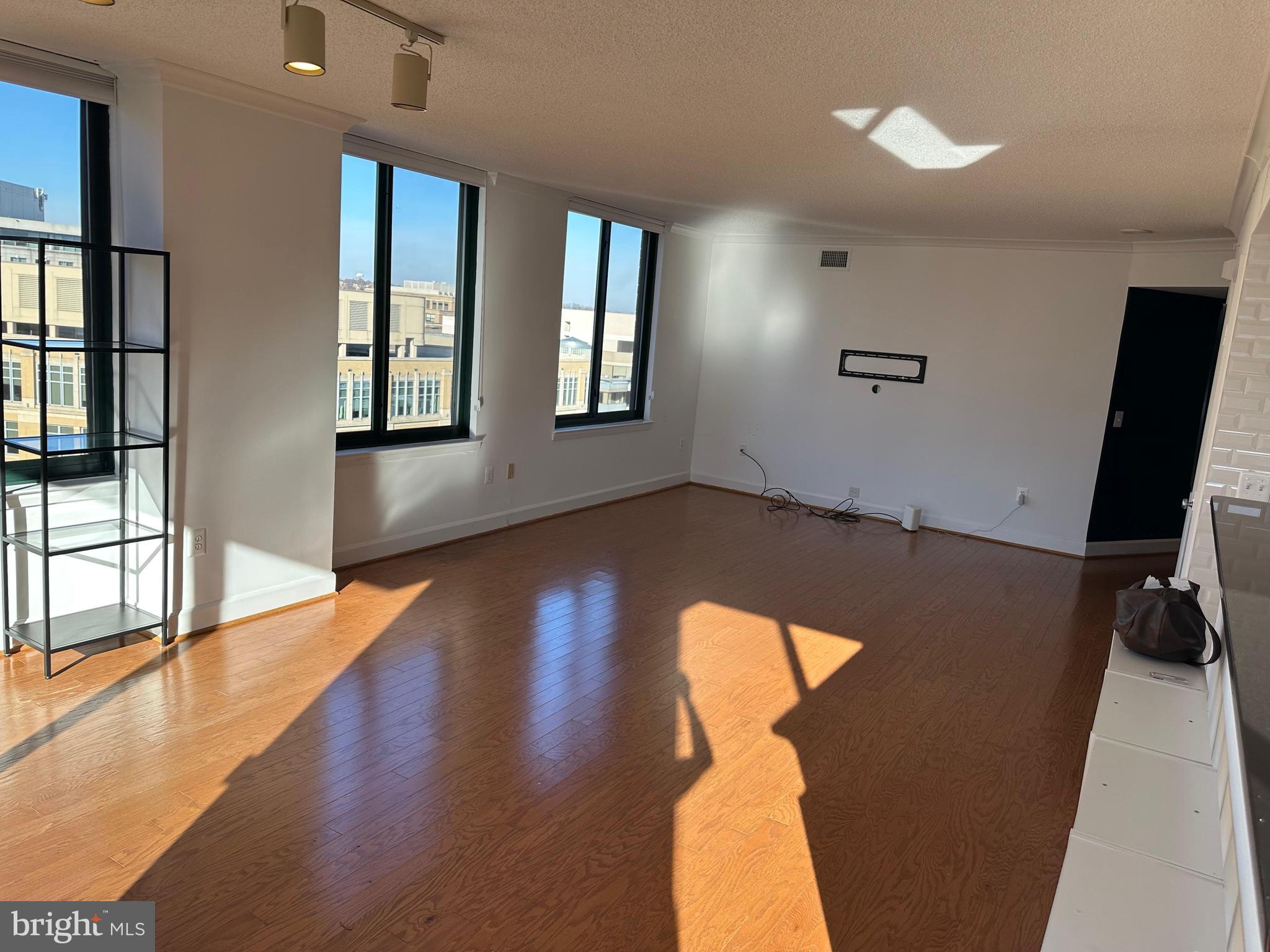 1220 North Fillmore Street, Unit 901 Arlington, VA 22201 - Photo 17 of 35 wooden floor in an empty room with a window