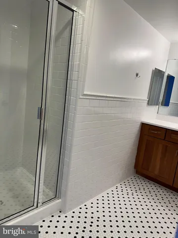 a bathroom with a sink a toilet a mirror and vanity