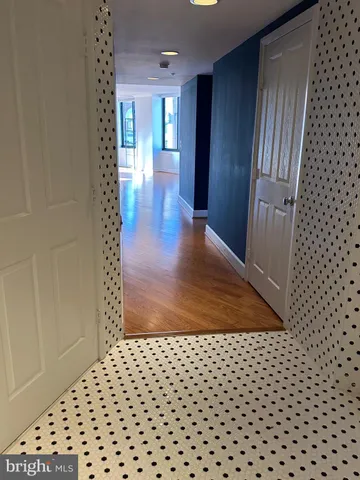 wooden floor in a hall with a window