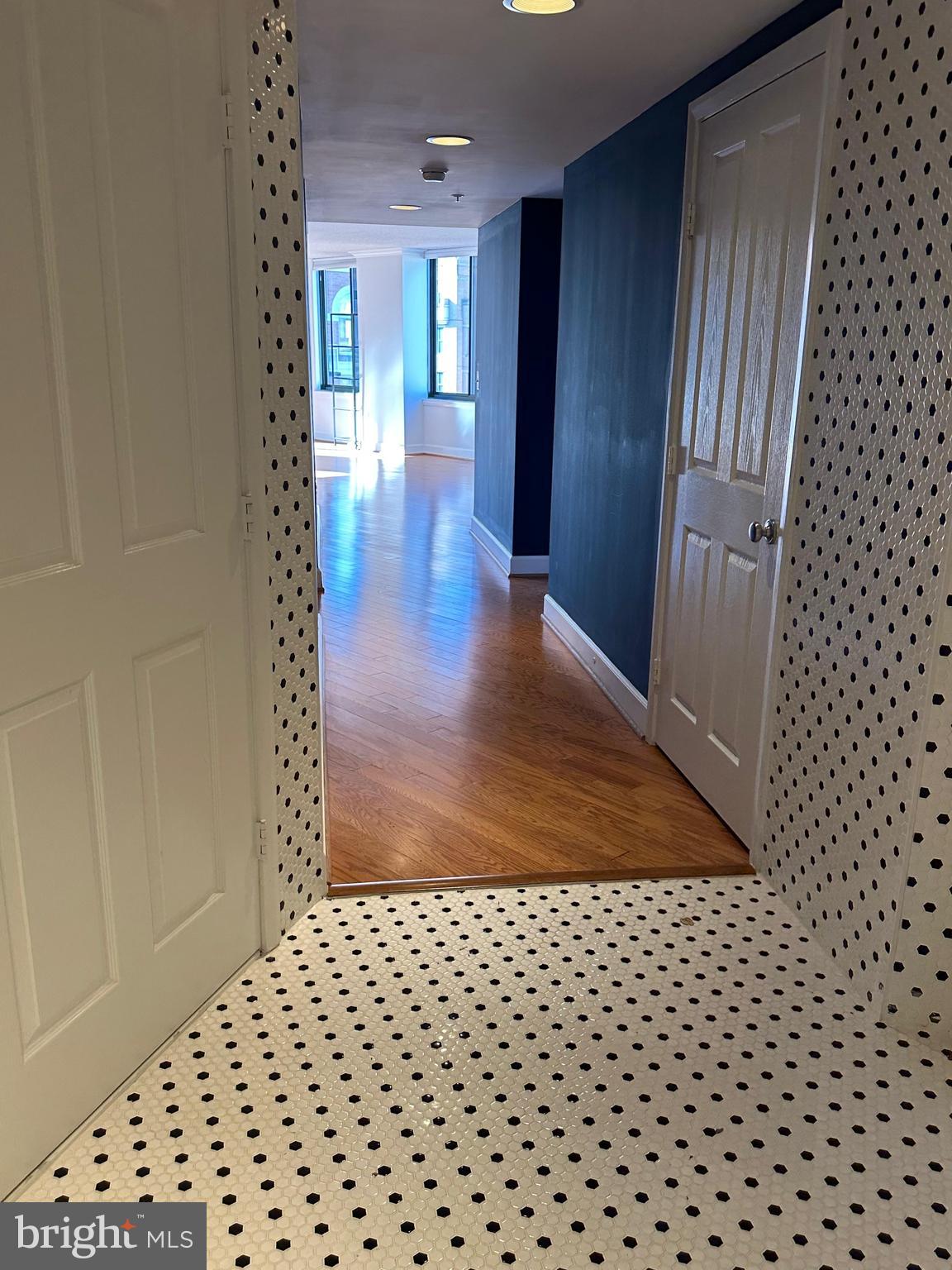 1220 North Fillmore Street, Unit 901 Arlington, VA 22201 - Photo 9 of 35 wooden floor in a hall with a window