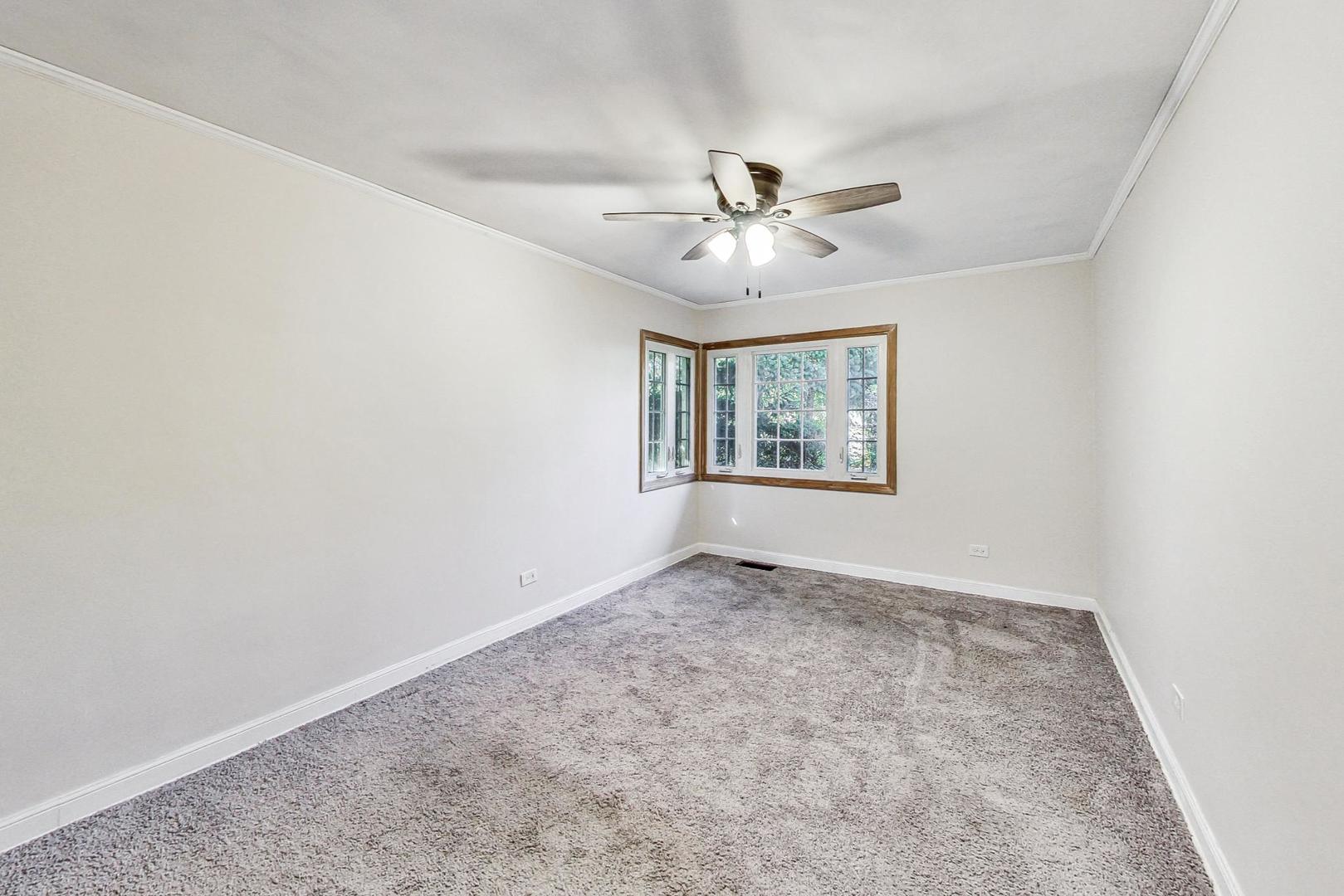 1205 183rd Street Homewood, IL 60430 - Photo 9 of 20 an empty room with windows and ceiling fan