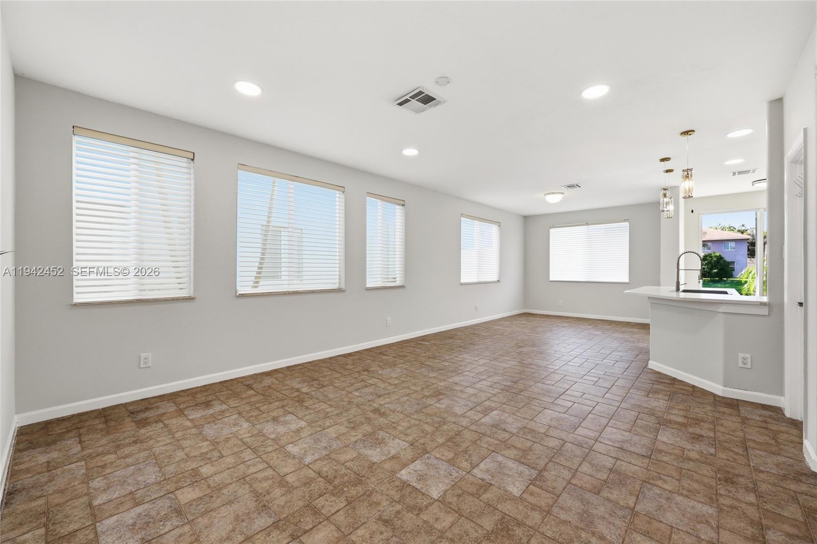 3059 Laurel Ridge Circle Riviera Beach, FL 33404 - Photo 4 of 25 a view of an empty room with a window