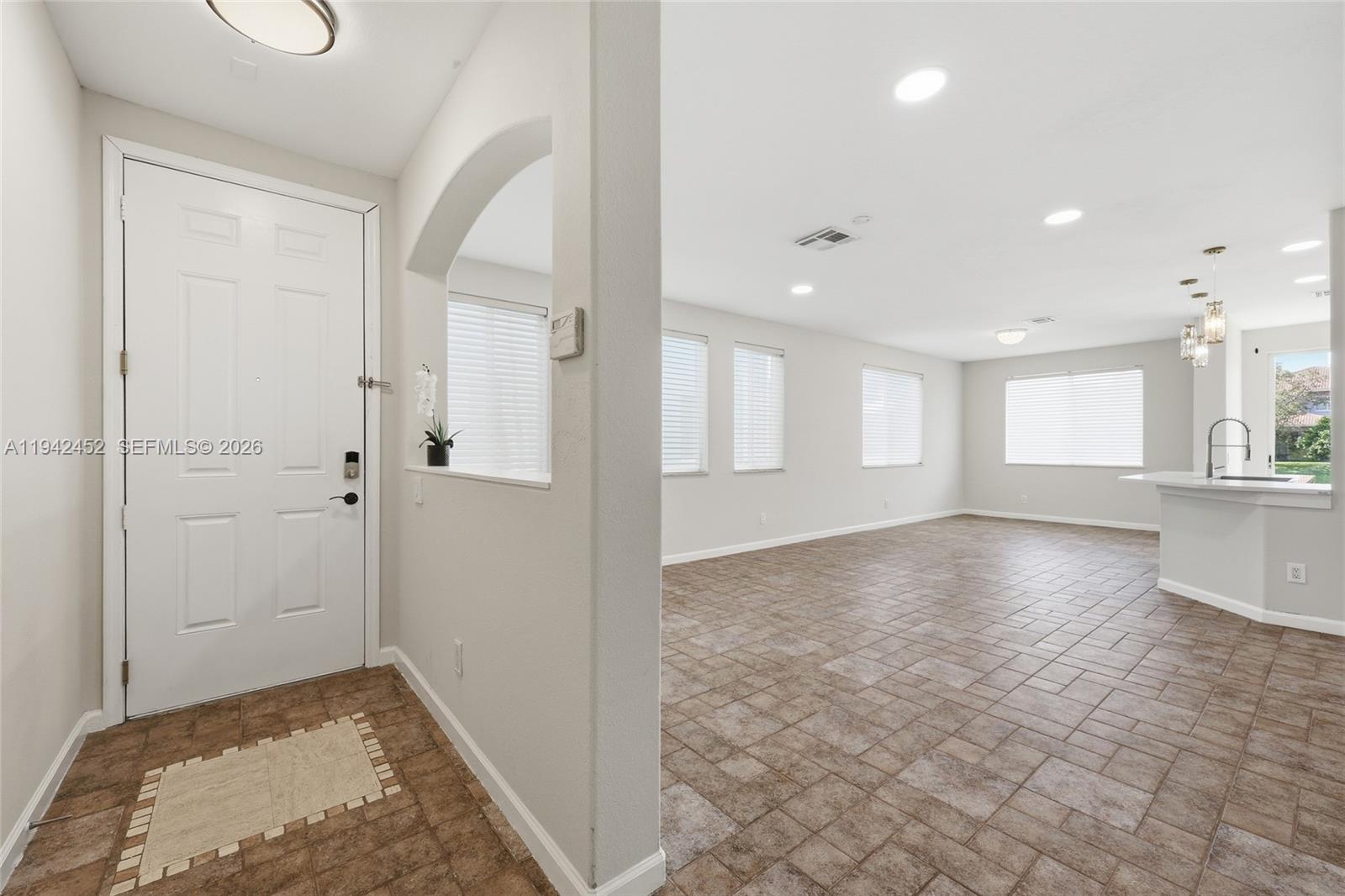 3059 Laurel Ridge Circle Riviera Beach, FL 33404 - Photo 10 of 25 a view of an empty room and window