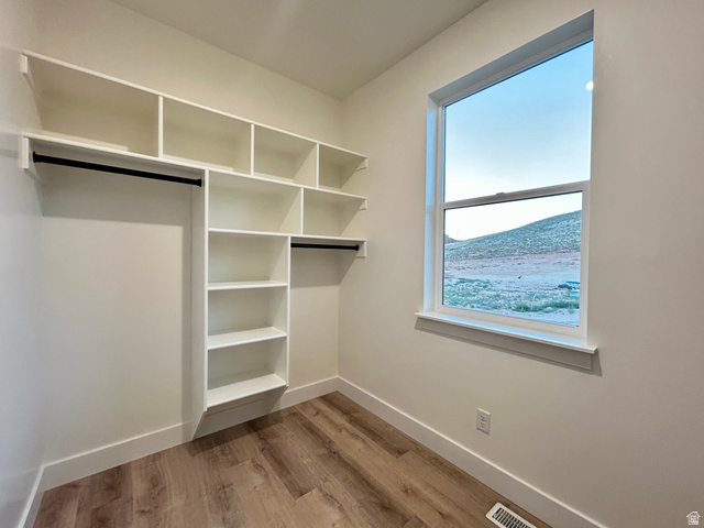 6 South 450th West Gunnison, UT 84634 - Photo 33 of 45 Built-in custom shelving and hanging rods in a neutral color palette