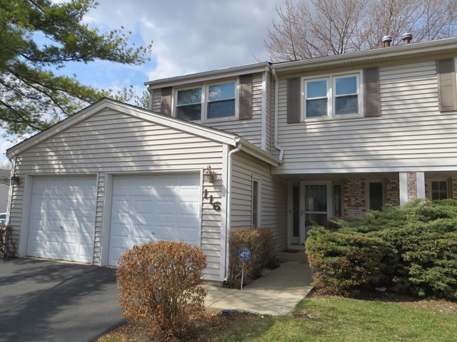 116 Julie Road Bolingbrook, IL 60440 - Photo 1 of 21 a front view of a house with garden