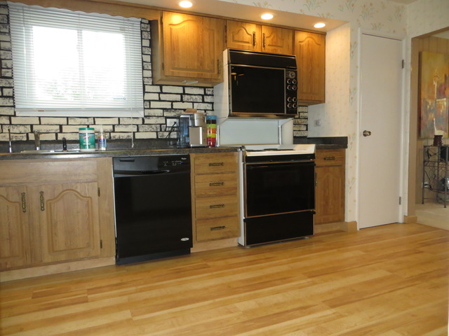 116 Julie Road Bolingbrook, IL 60440 - Photo 2 of 21 a kitchen with stainless steel appliances granite countertop a stove and a refrigerator