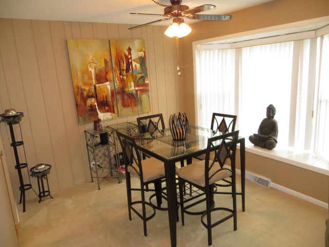 116 Julie Road Bolingbrook, IL 60440 - Photo 5 of 21 a view of a dining room with furniture and a window