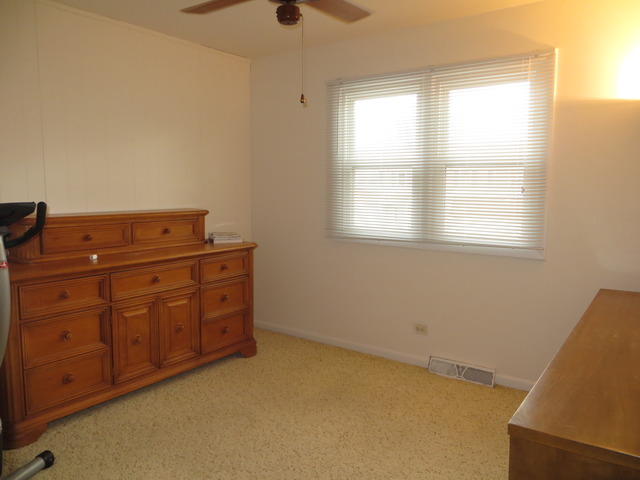 116 Julie Road Bolingbrook, IL 60440 - Photo 8 of 21 an empty room with windows