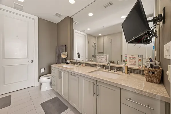 a living room with a couch and a floor to ceiling window