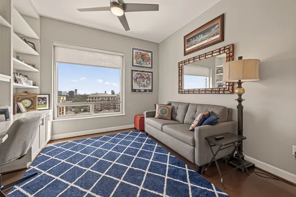 a bathroom with a granite countertop sink a toilet and shower