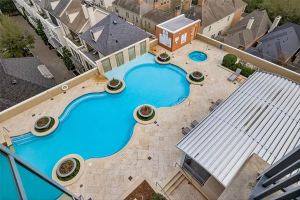 a view of a swimming pool with a table and chairs