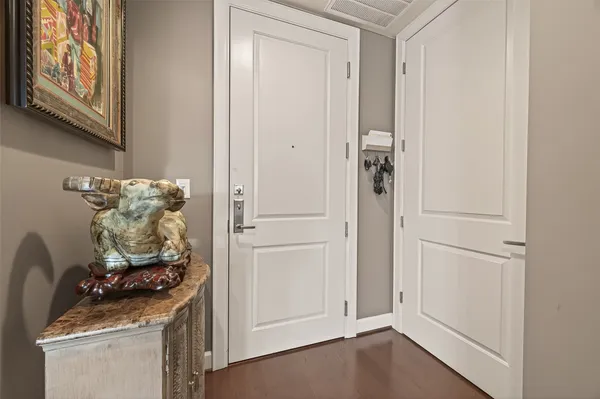 a front view of a house with a garden and outdoor seating