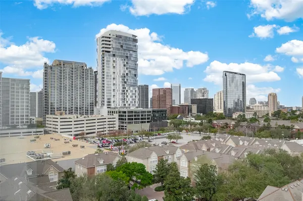a view of a swimming pool with outdoor seating