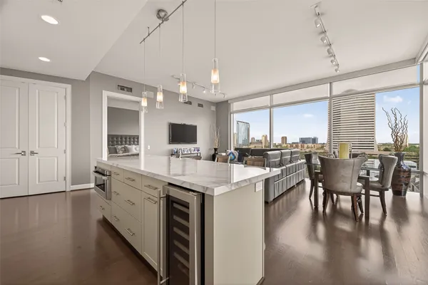 a kitchen with stainless steel appliances granite countertop a stove and cabinets