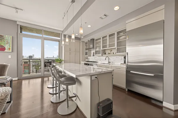 a kitchen with a sink and cabinets