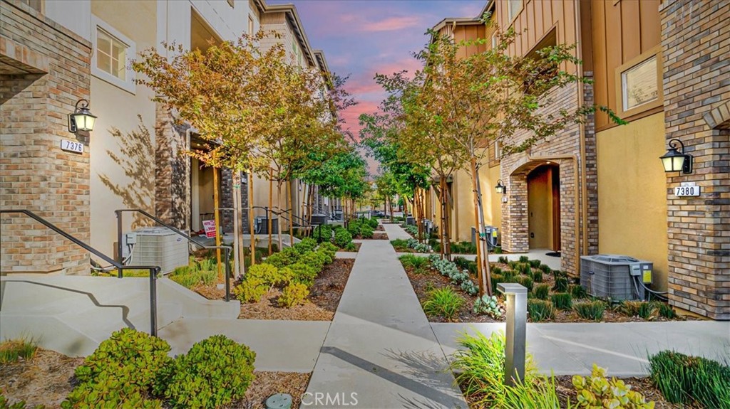 7384 Solstice Place Rancho Cucamonga, CA 91739 - Photo 1 of 1 a view of a pathway with house on both side
