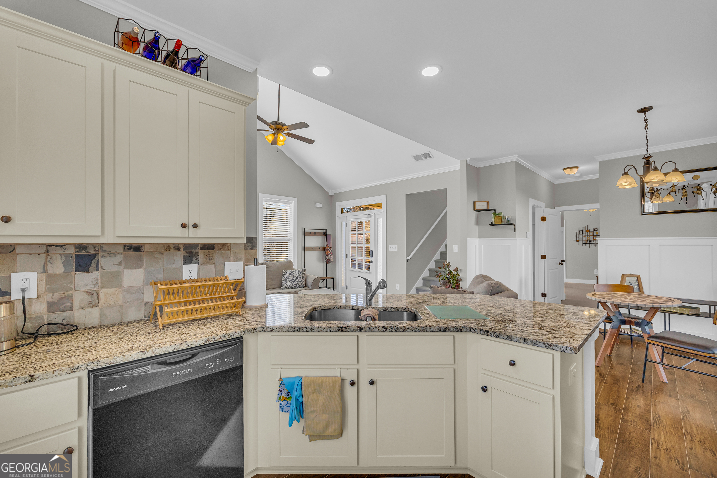 236 Melba Lane Athens, GA 30606 - Photo 11 of 33 a kitchen with granite countertop a sink a stove and cabinets