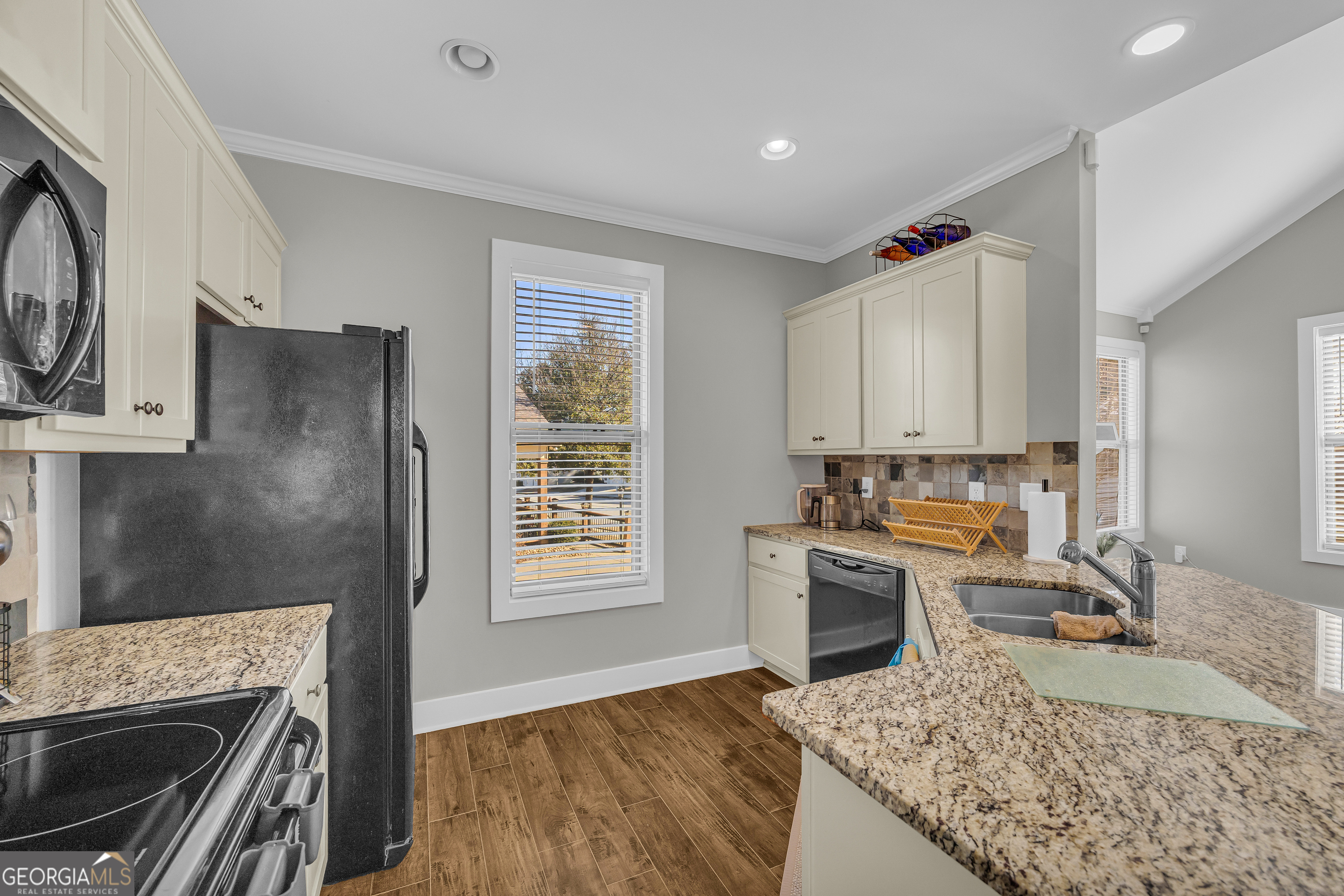 236 Melba Lane Athens, GA 30606 - Photo 12 of 33 a kitchen with a stove a sink and a refrigerator