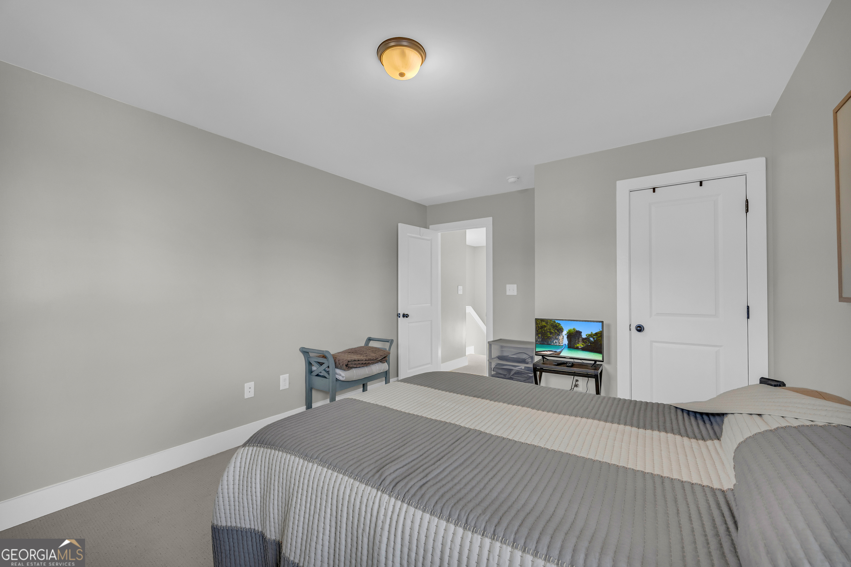 236 Melba Lane Athens, GA 30606 - Photo 20 of 33 a bedroom with a bed and a chair