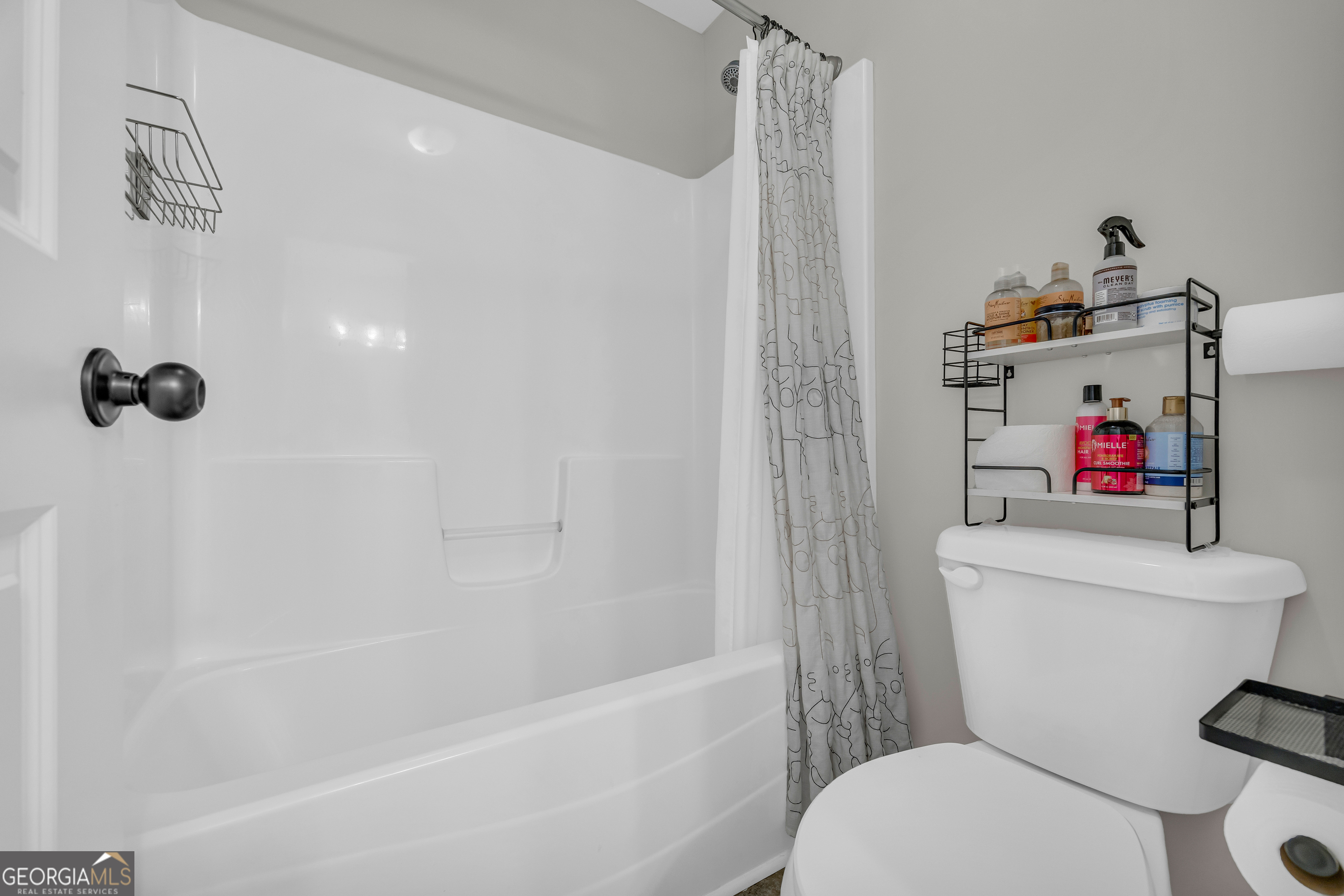 236 Melba Lane Athens, GA 30606 - Photo 23 of 33 a white toilet sitting next to a bath tub