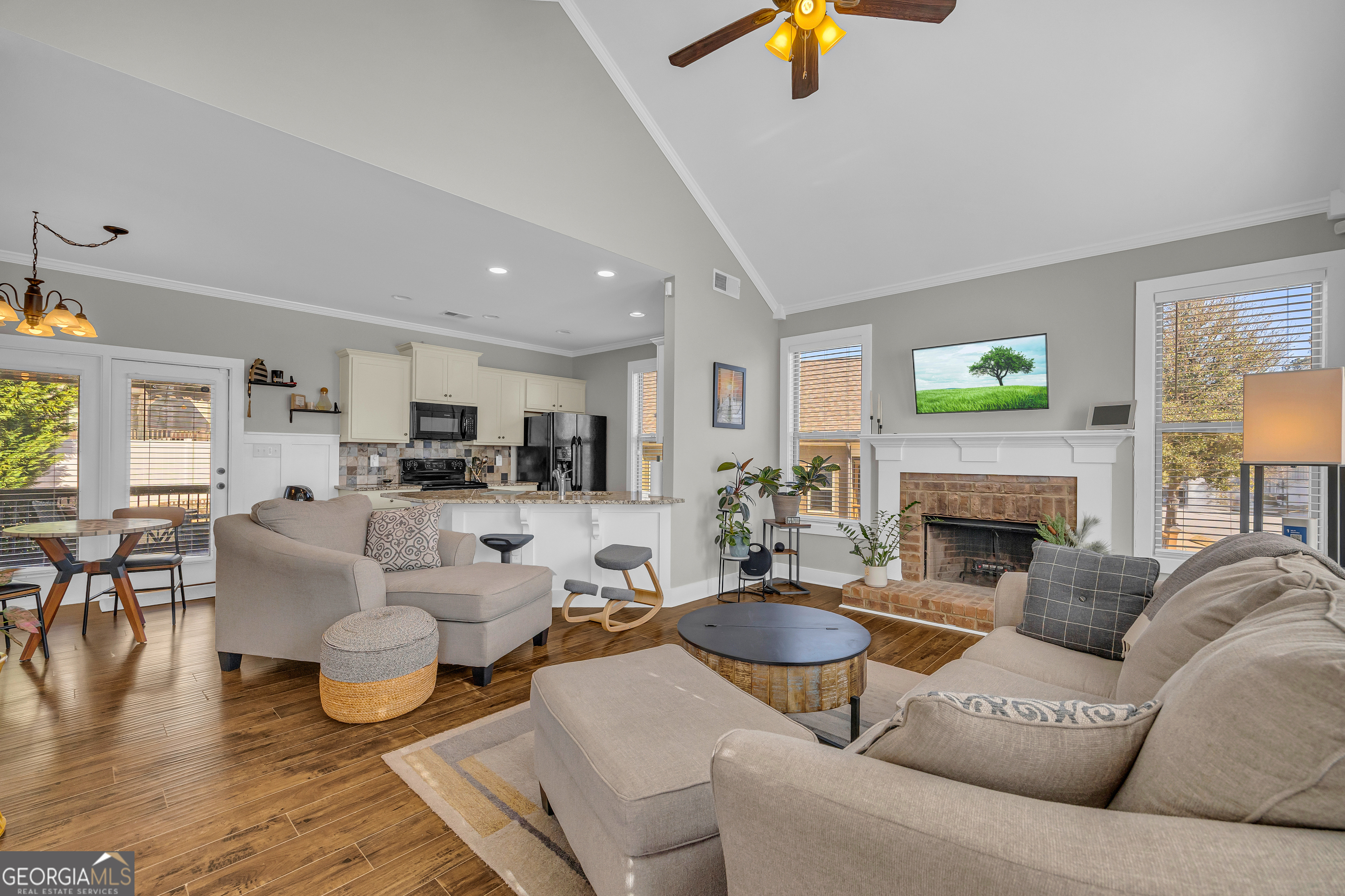 236 Melba Lane Athens, GA 30606 - Photo 6 of 33 a living room with furniture a fireplace and a flat screen tv