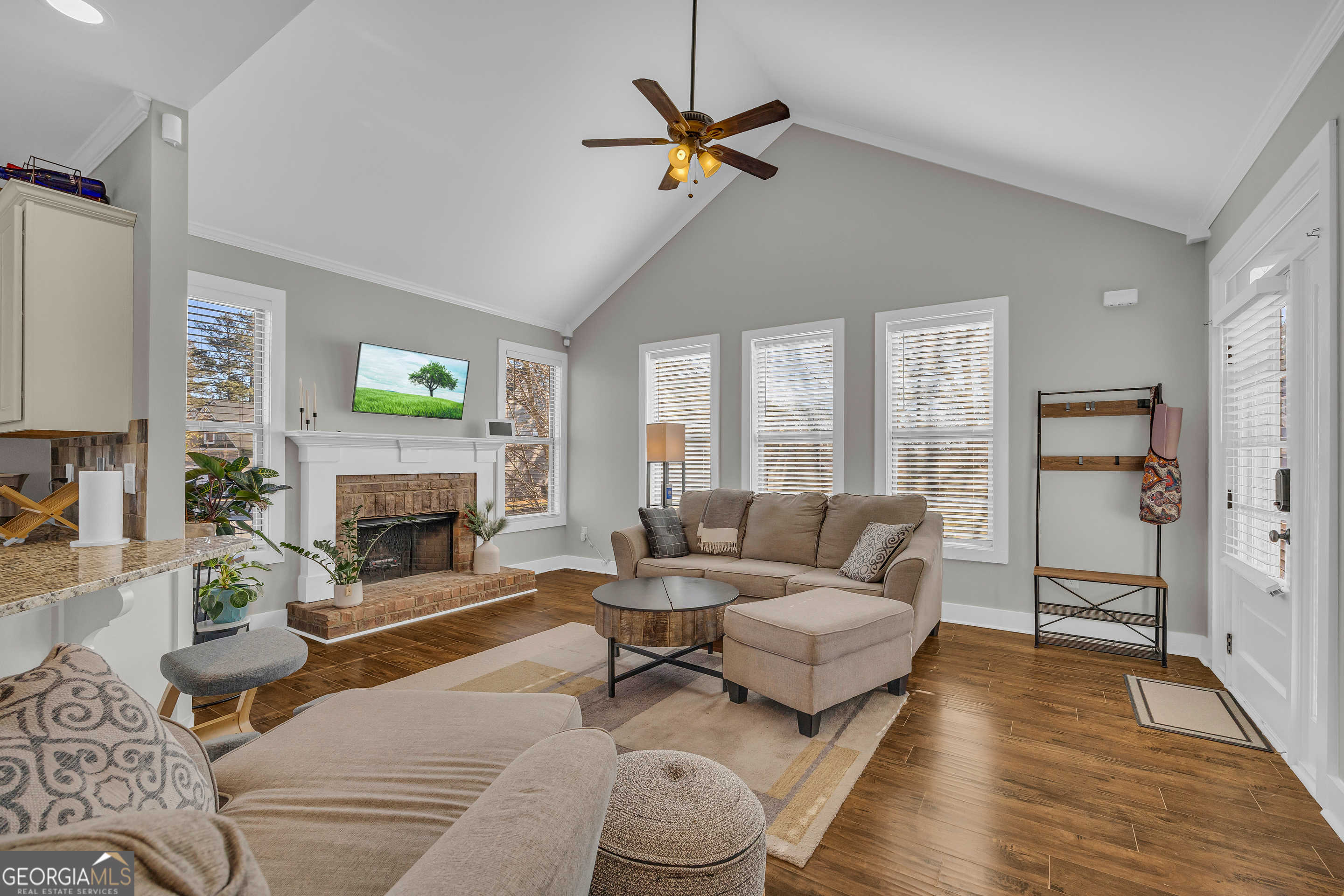 236 Melba Lane Athens, GA 30606 - Photo 8 of 33 a living room with furniture a fireplace and a floor to ceiling window