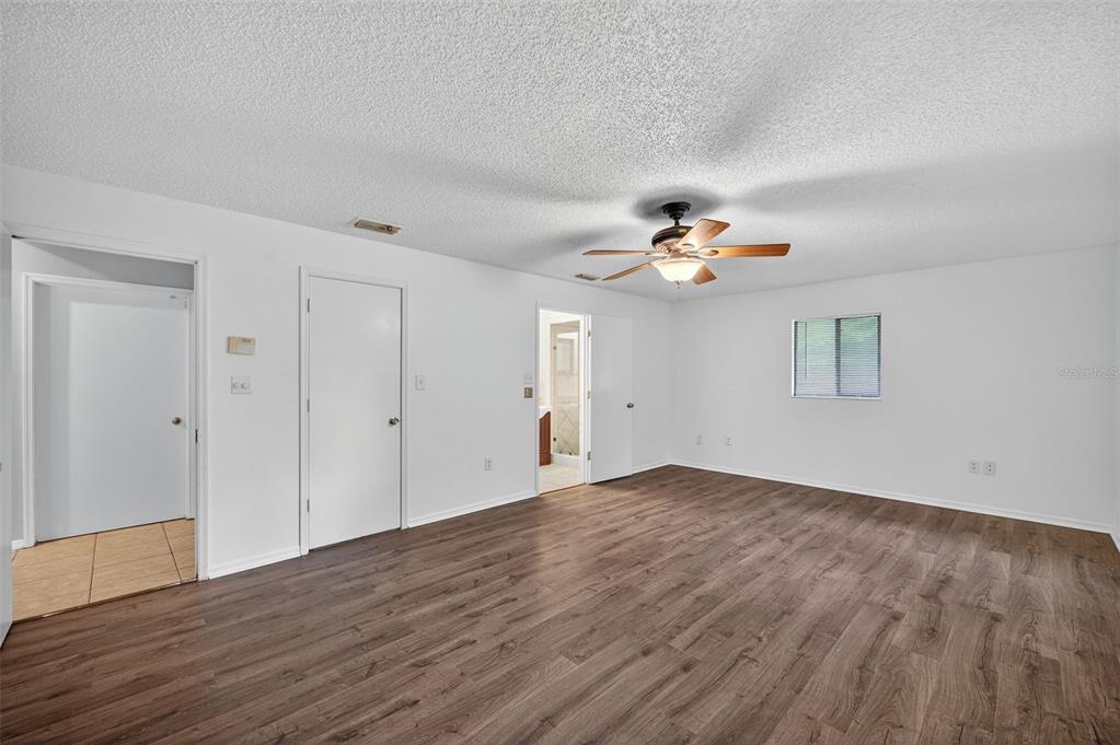 4618 Deeson Road Lakeland, FL 33810 - Photo 11 of 36 a view of empty room with wooden floor