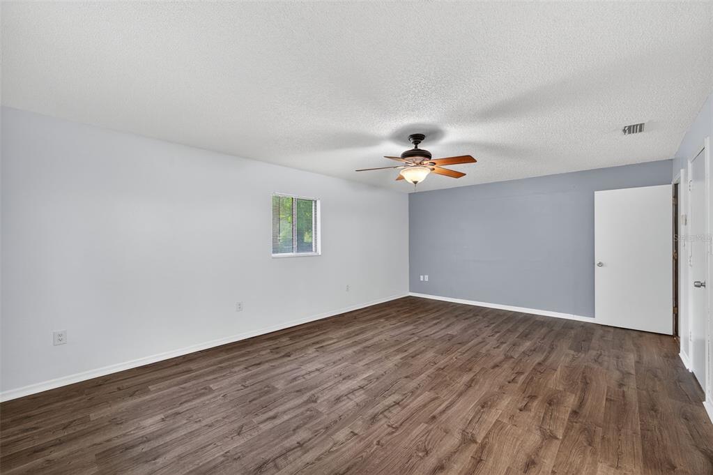 4618 Deeson Road Lakeland, FL 33810 - Photo 13 of 36 a view of empty room with wooden floor