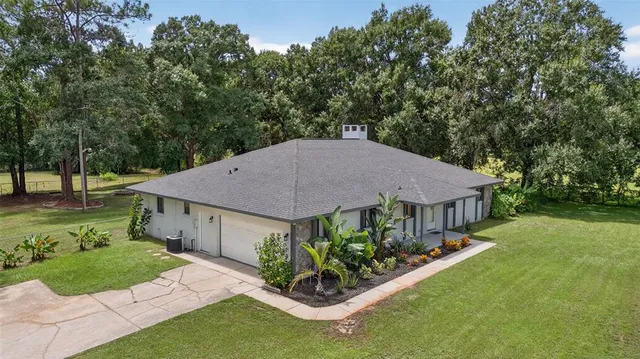 a aerial view of a house with garden