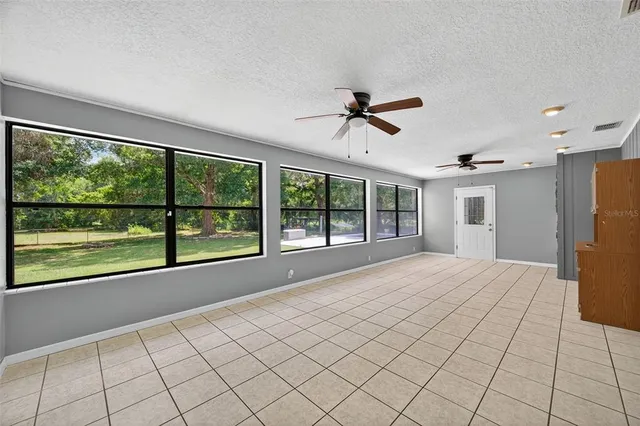 a view of an empty room with a large window