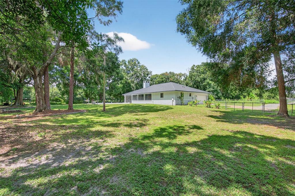 4618 Deeson Road Lakeland, FL 33810 - Photo 25 of 36 a view of a house with a yard