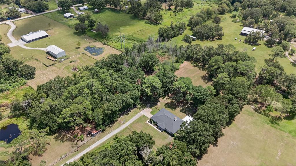 4618 Deeson Road Lakeland, FL 33810 - Photo 33 of 36 an aerial view of a house with a yard and lake view