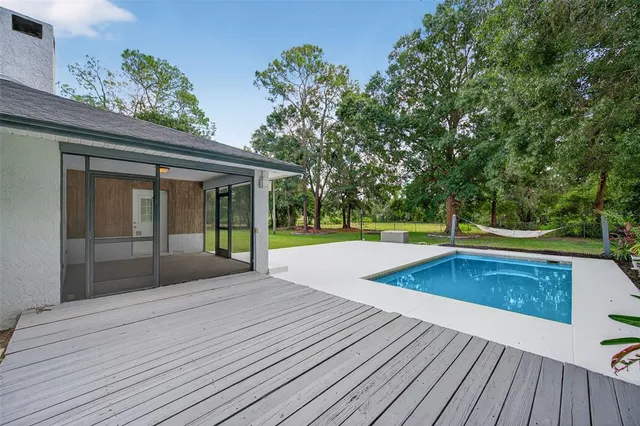 a view of outdoor space swimming pool and yard