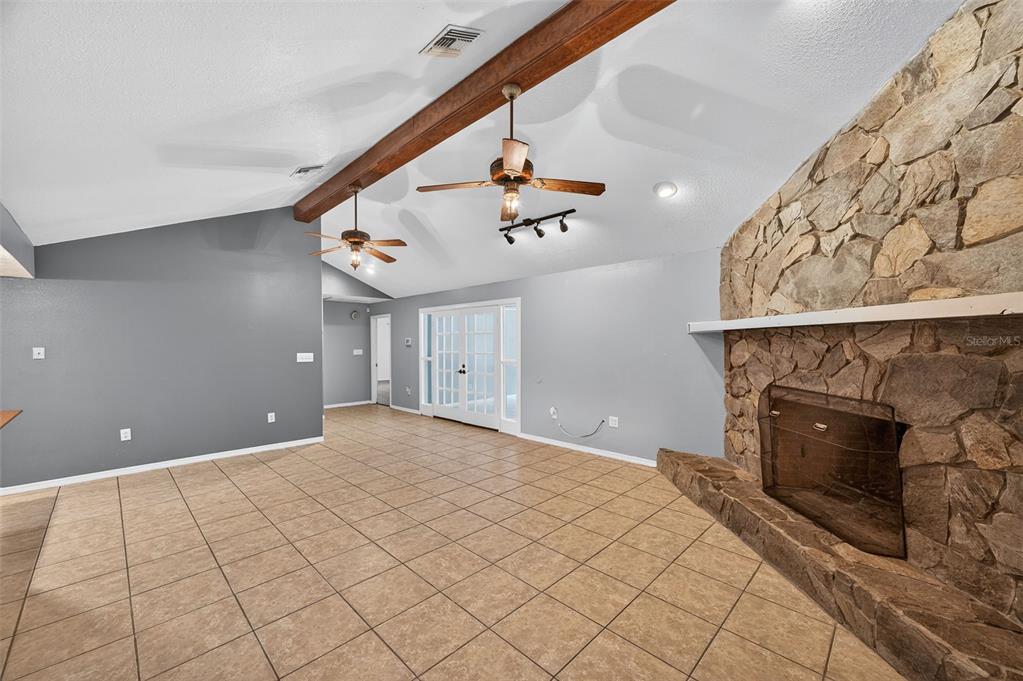 4618 Deeson Road Lakeland, FL 33810 - Photo 7 of 36 a view of an empty room and chandelier fan