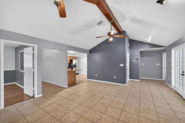 a view of a hallway with closet and wooden floor