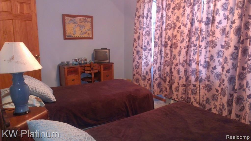 7230 Harrington Road Lexington, MI 48450 - Photo 32 of 46 bdr 3 upstairs large enough for 2 twins, dressers and desk.jpg
