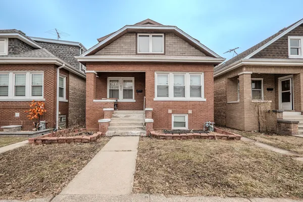 front view of a house with a yard