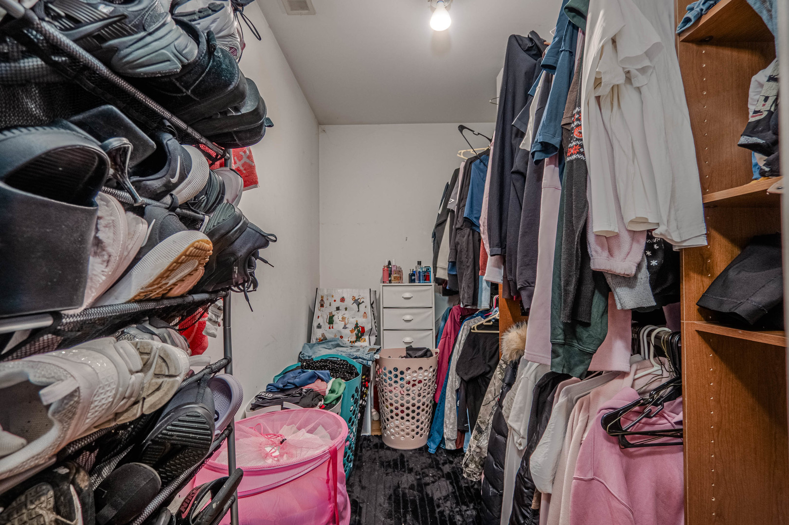 1435 Grove Avenue Berwyn, IL 60402 - Photo 16 of 25 a view of walk in closet with clothes and shoes