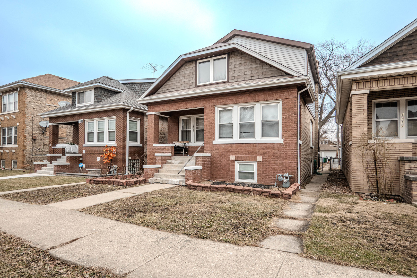 1435 Grove Avenue Berwyn, IL 60402 - Photo 2 of 25 a view of a house with large windows and plants