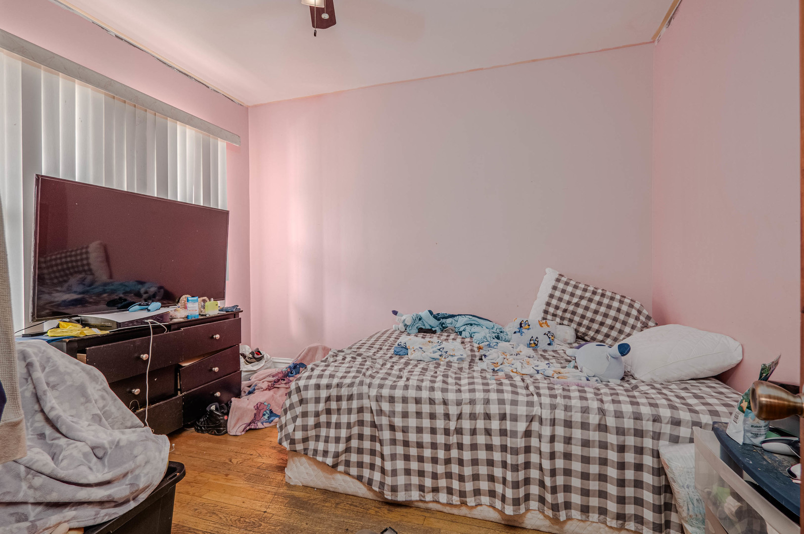 1435 Grove Avenue Berwyn, IL 60402 - Photo 4 of 25 a bedroom with a bed and a tv