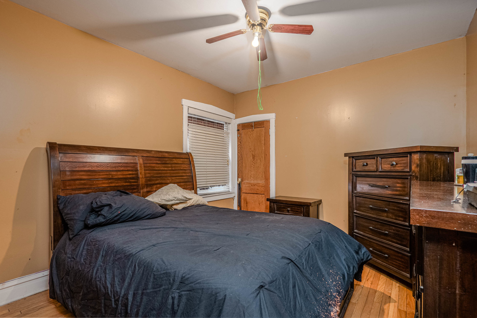 1435 Grove Avenue Berwyn, IL 60402 - Photo 5 of 25 a bedroom with a bed and ceiling fan