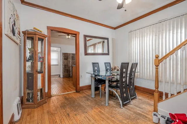 a view of a dining room with furniture and a window