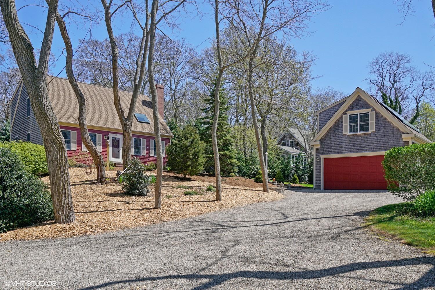 230 Locust Road Eastham, MA 02642 - Photo 1 of 17 front view of a house with a yard